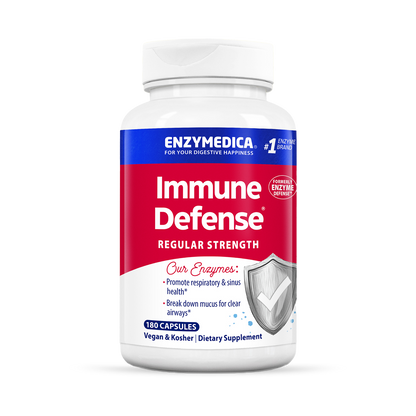 A bottle of Enzymedica Immune Defense Regular Strength dietary supplement with 120 capsules, predominantly white and blue in color, with additional branding and product information.